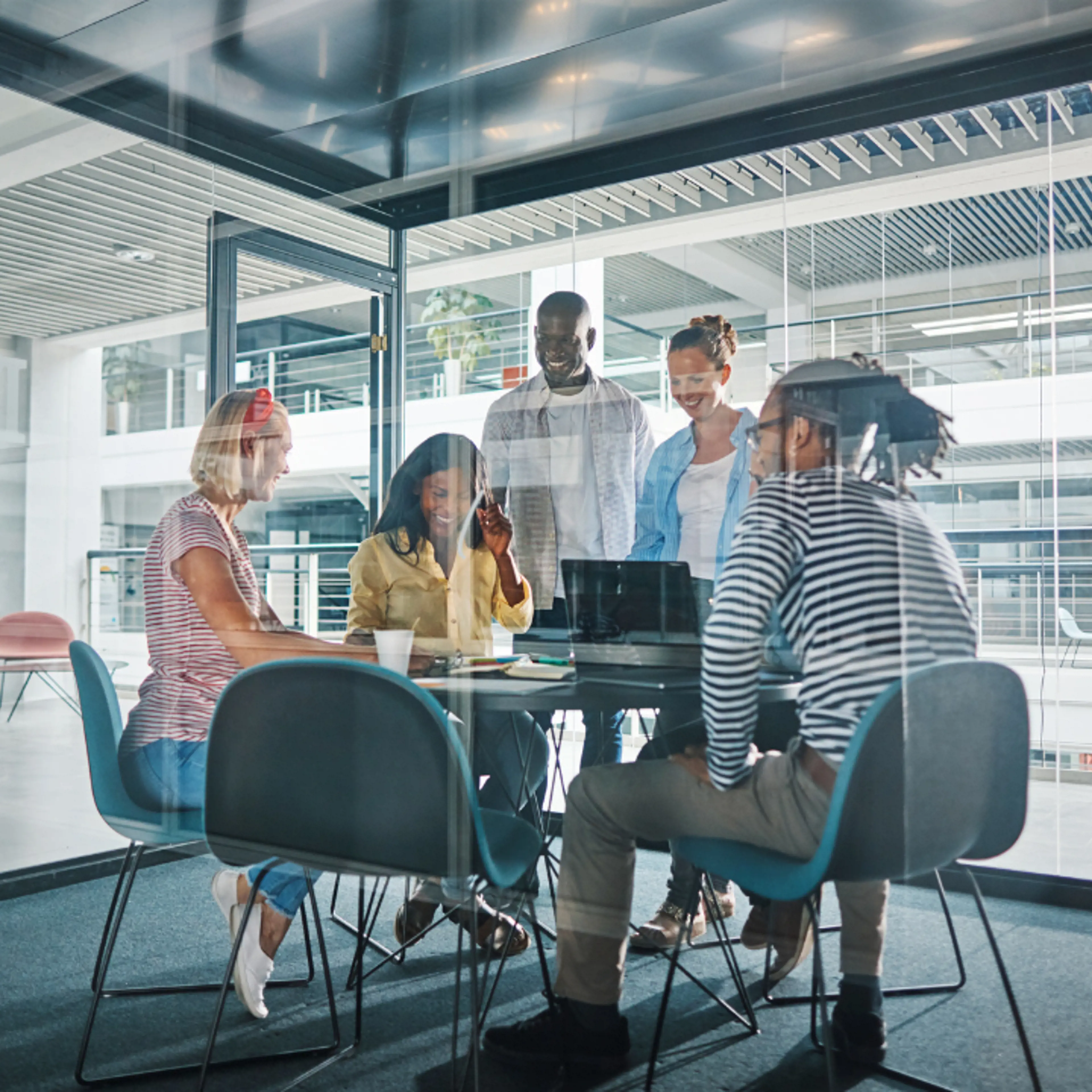 Group of four people having a meeting