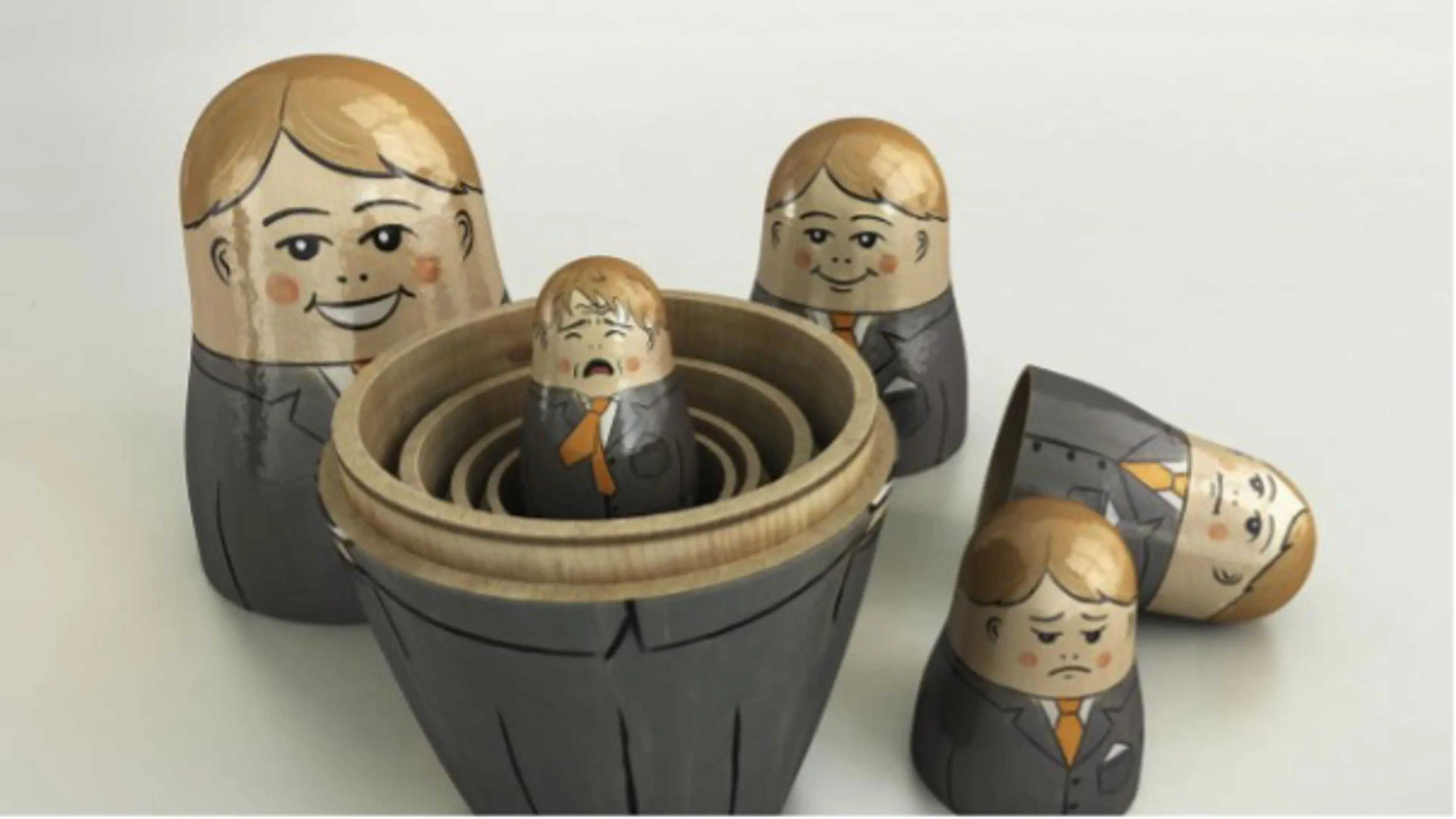 Manager as Russian dolls destacked, with faces changing from the biggest one smiling to the smallest one crying