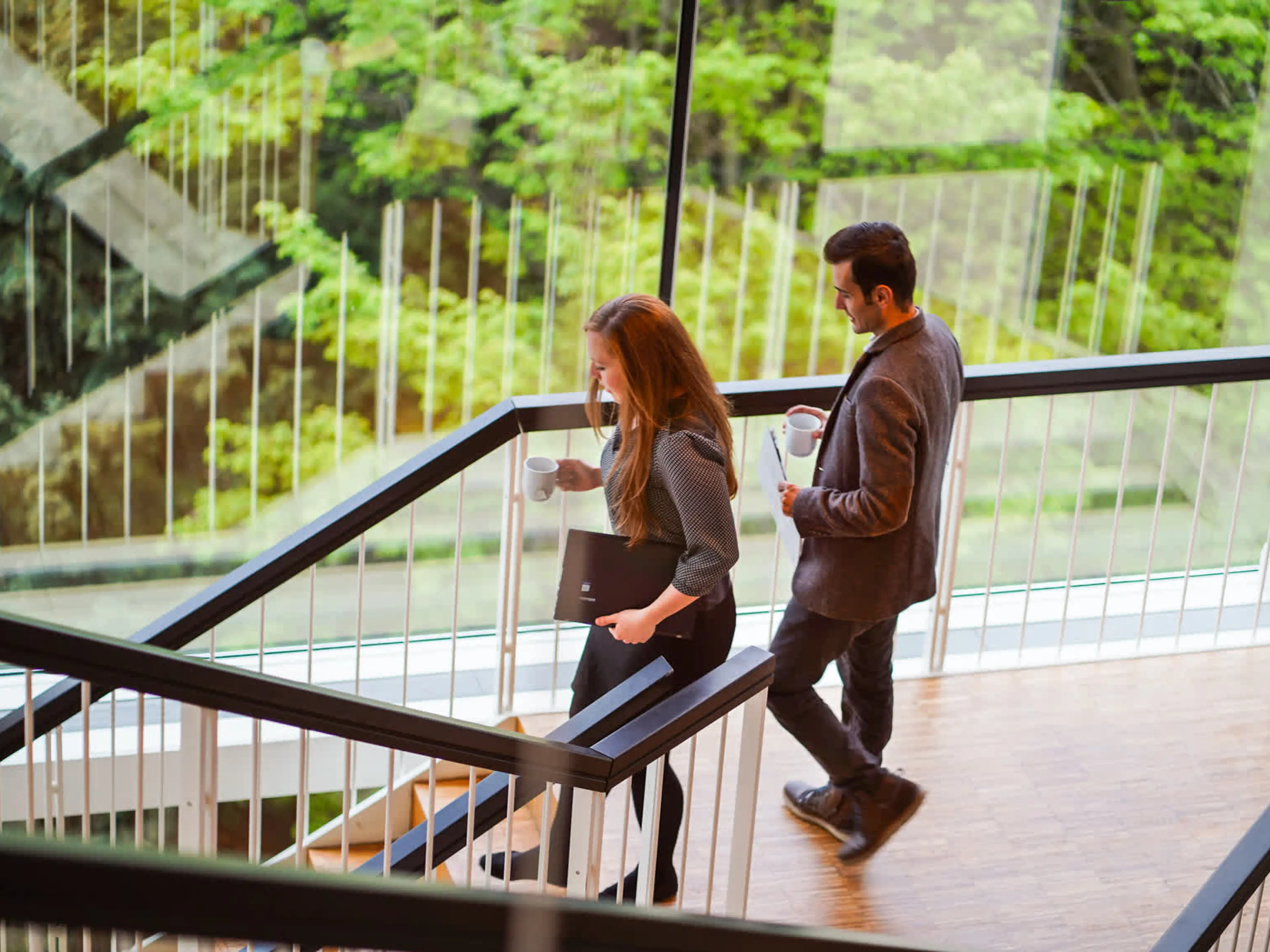 Two Full-Time MBA participants walking down the stairs