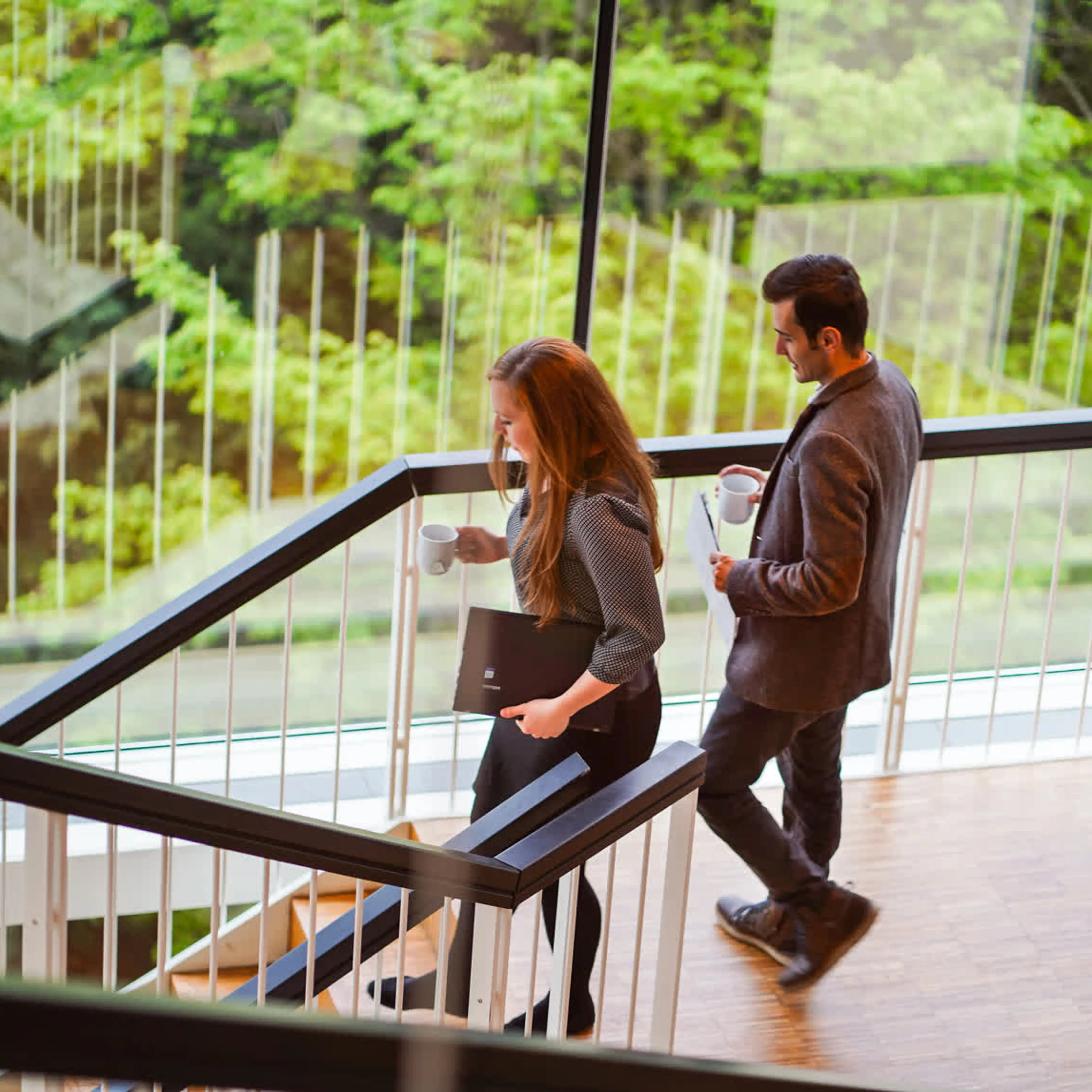 Two Full-Time MBA participants walking down the stairs