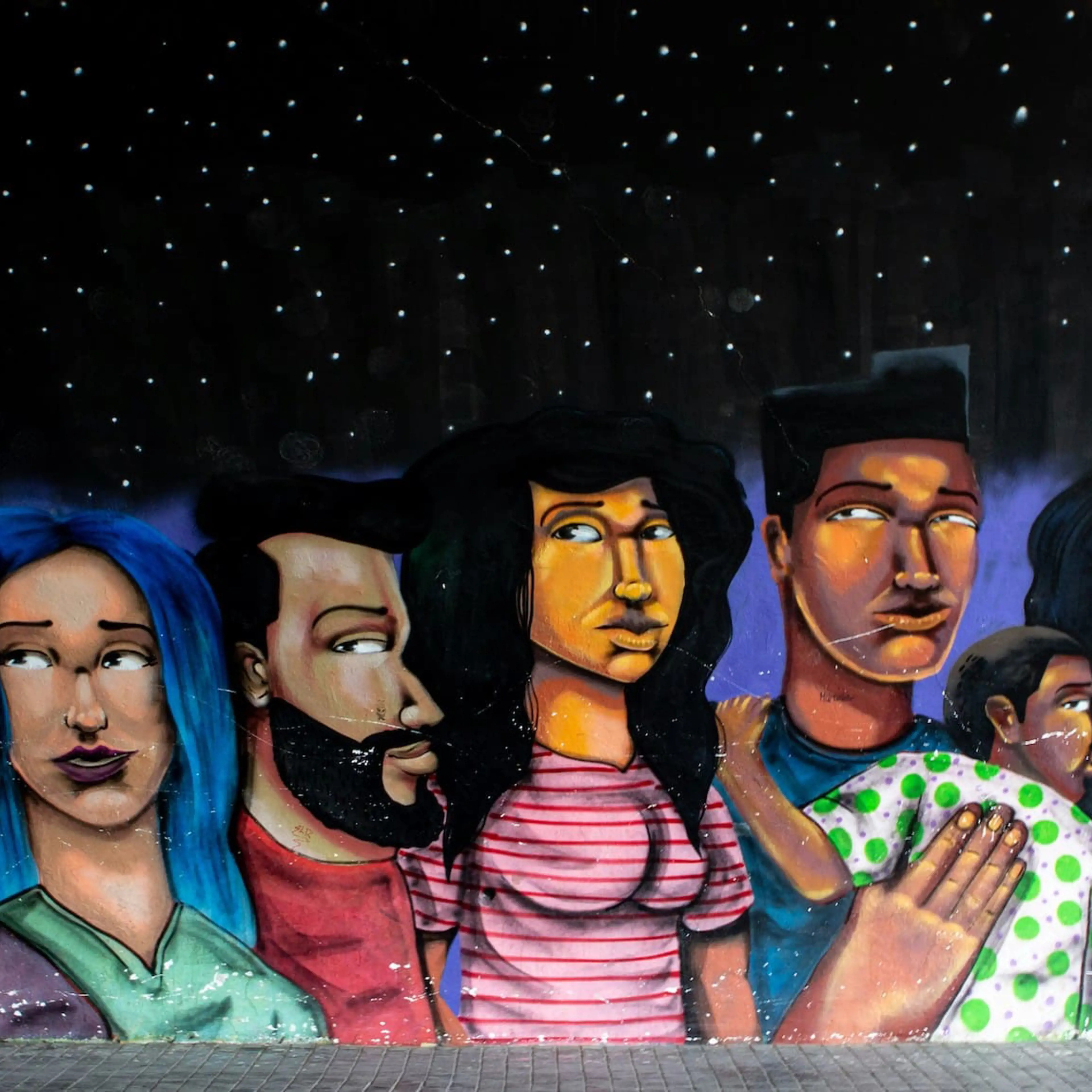 Picture of a mural showing people of various genders and ethnicities