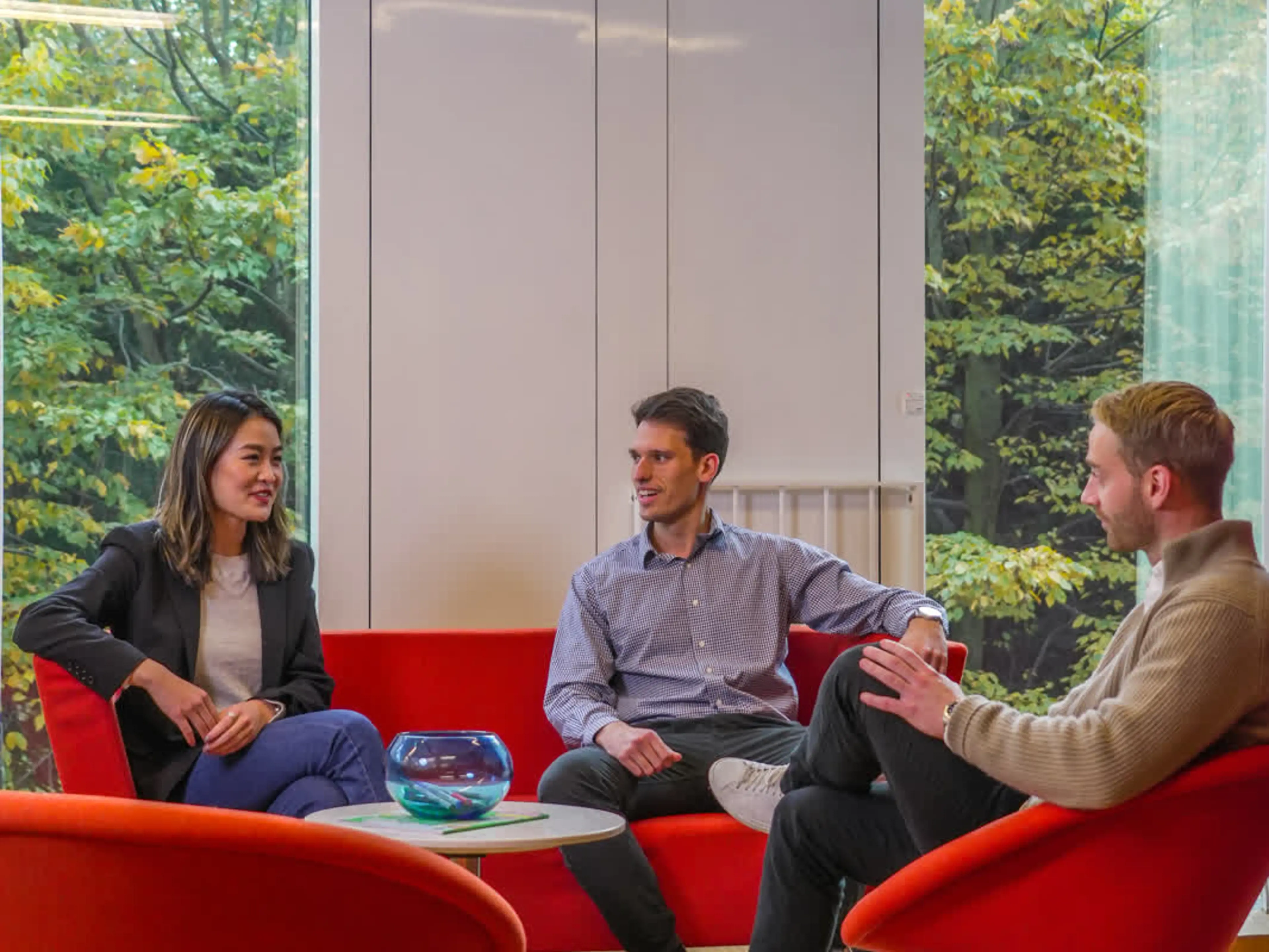 Picture of three Copenhagen MBA students talking