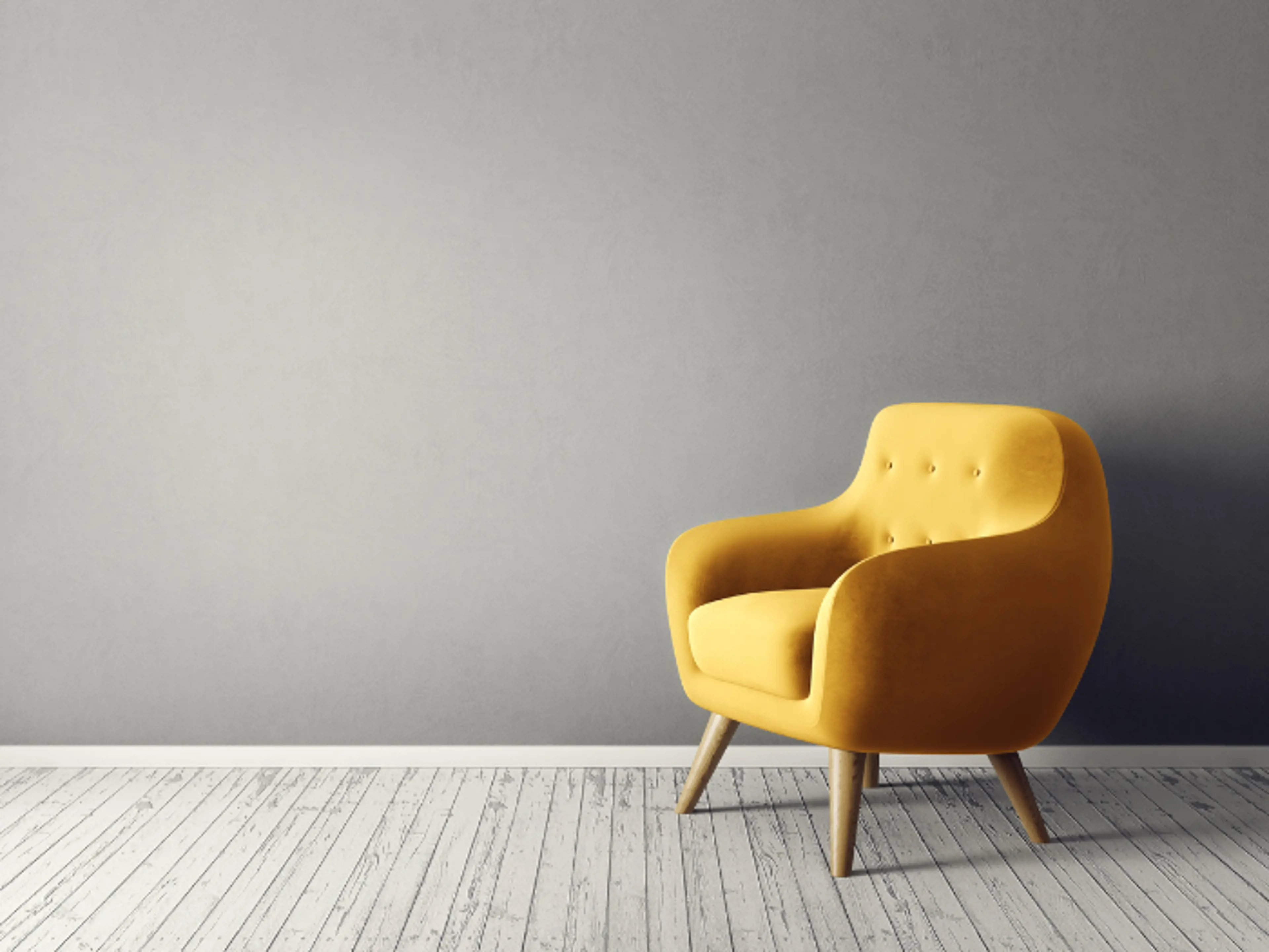 Yellow arm chair standing in a room