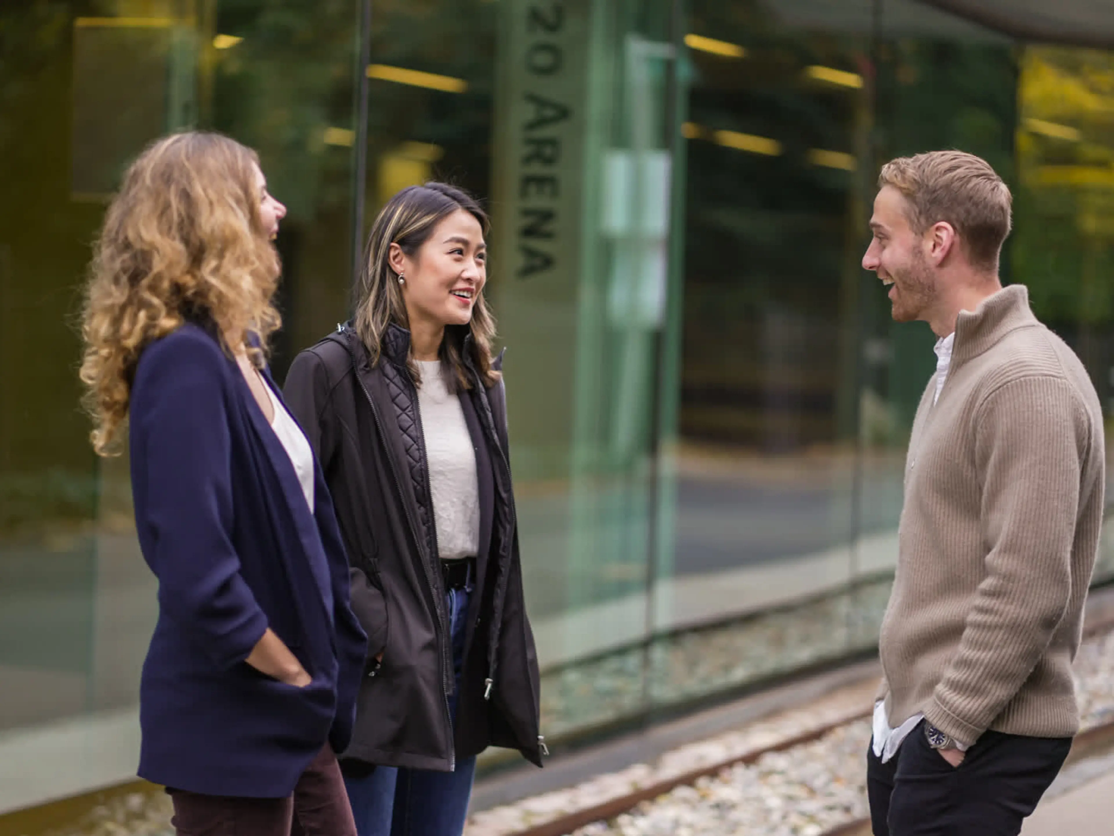 Picture of Full-Time MBA students talking outside the MBA building