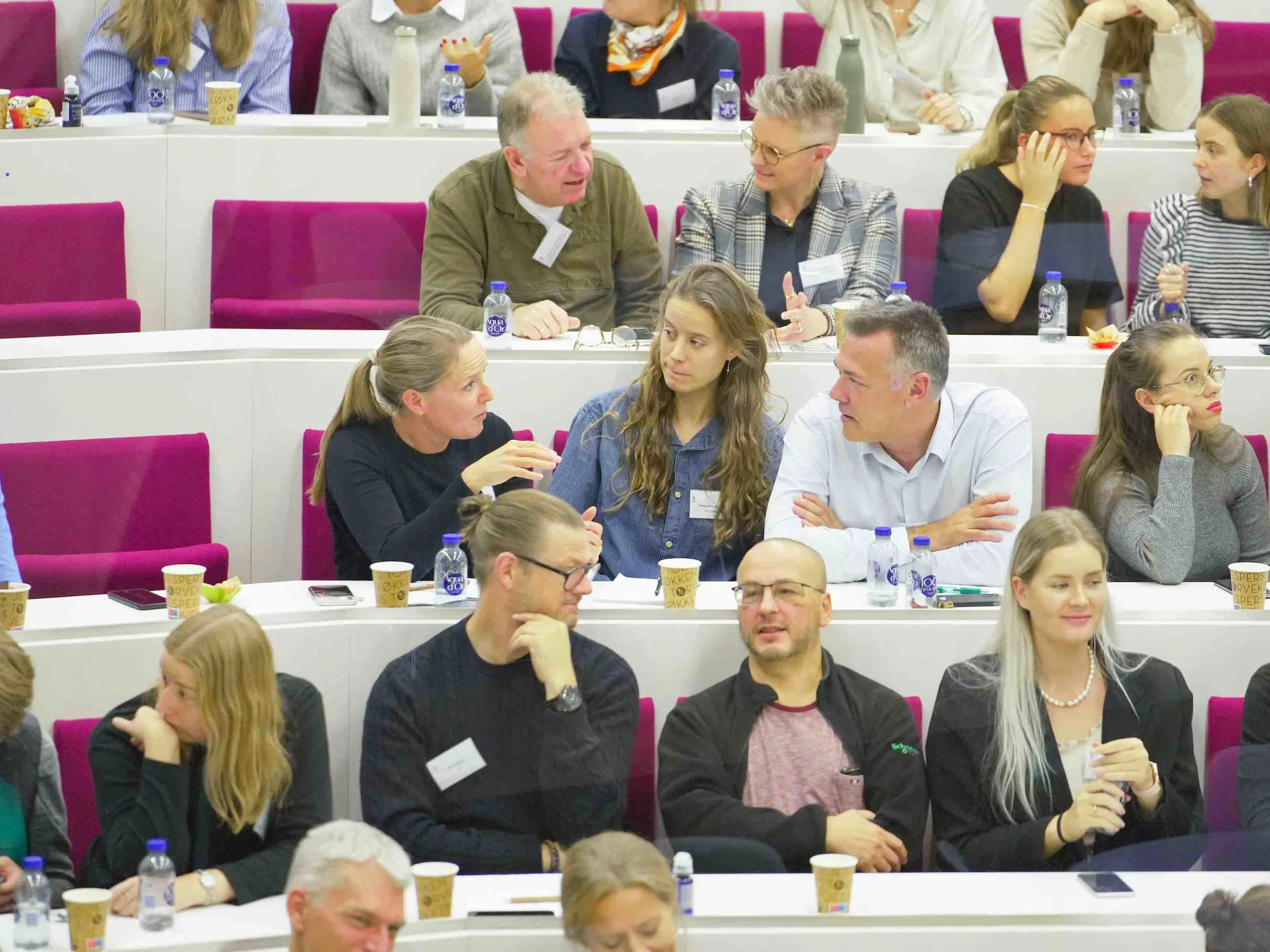 Audience speaking together at the New Management Strategies for New Generations event