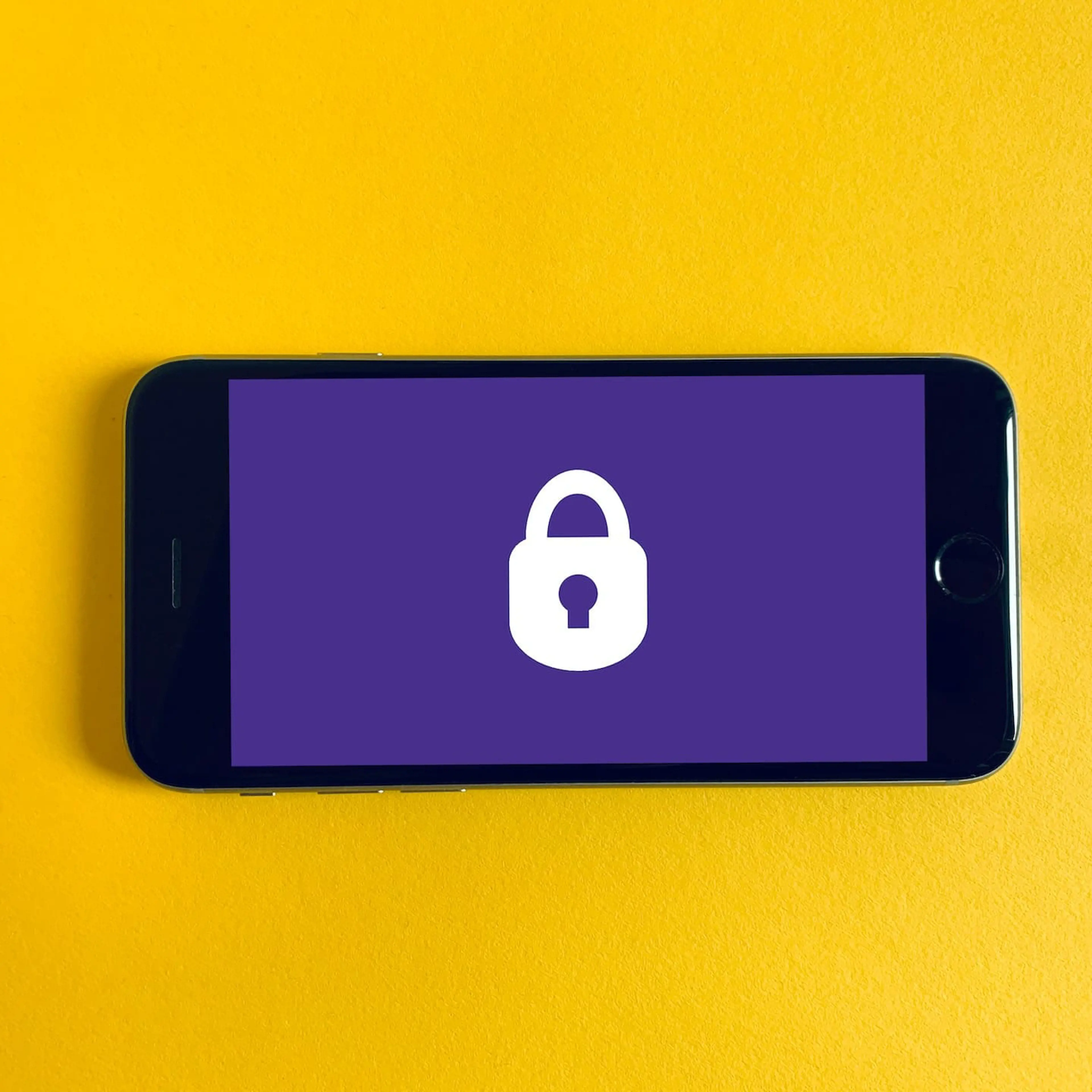 Locked Iphone on a yellow background