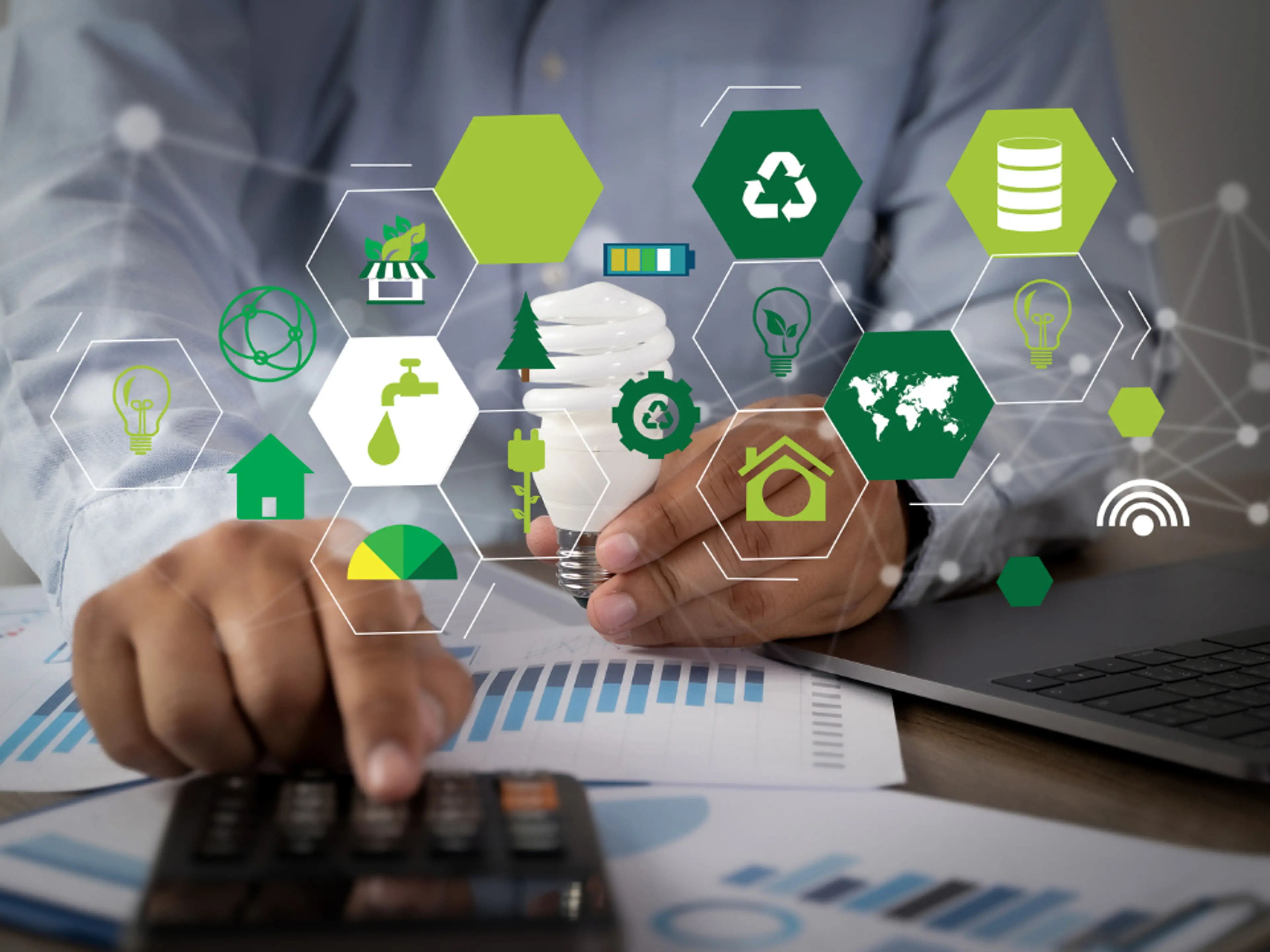 Picture of a man working surrounded by icons representing sustainability