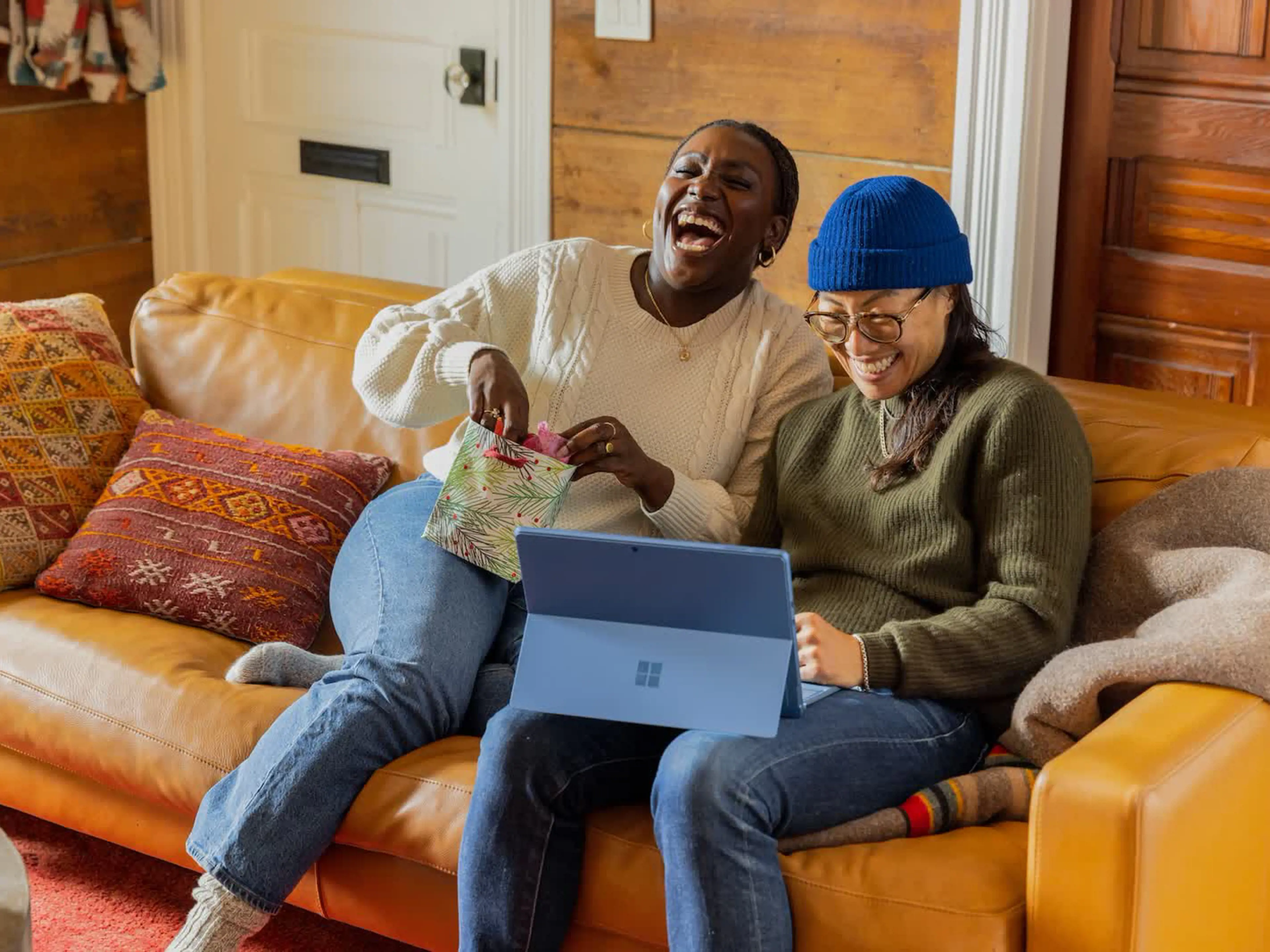 Picture of two people laughing in the living room