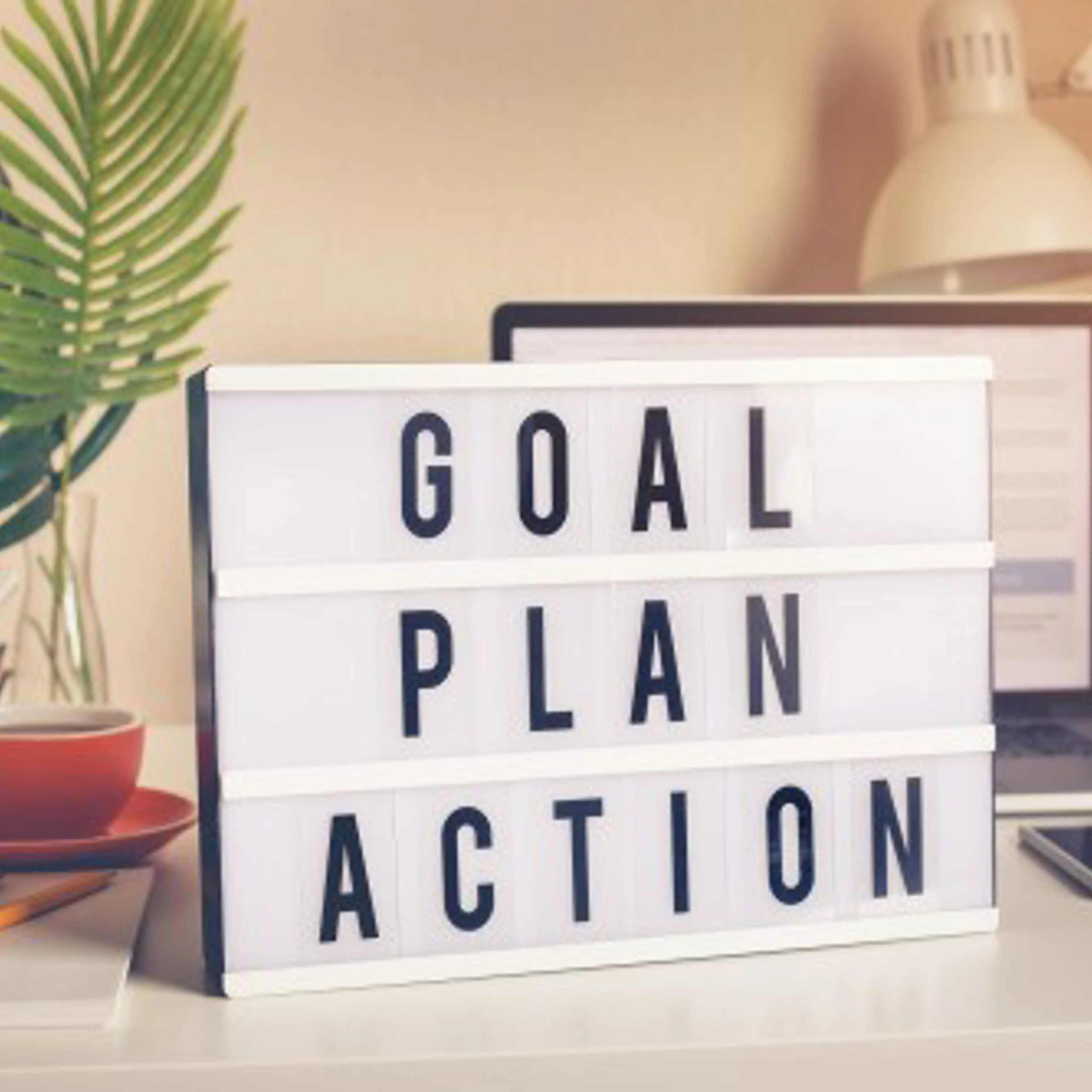 Picture of a sign saying: Goal, plan, action